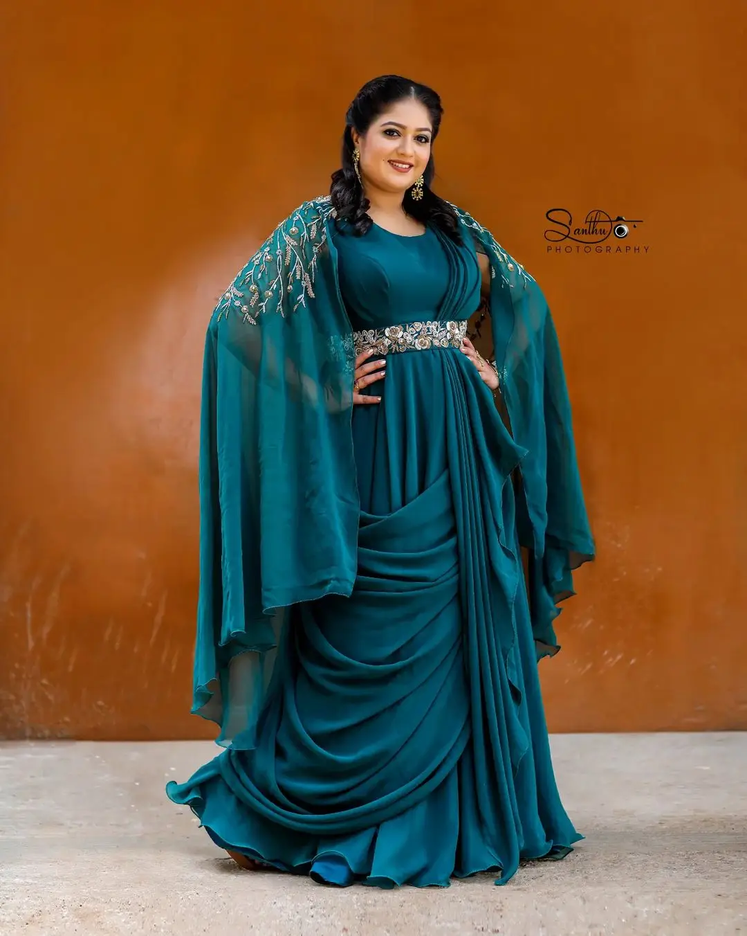 Meghana Raj Wearing Beautiful Earring Blue Gown